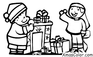 Noël / Mode de Noël: Un garçon qui met un chapeau de Père Noël